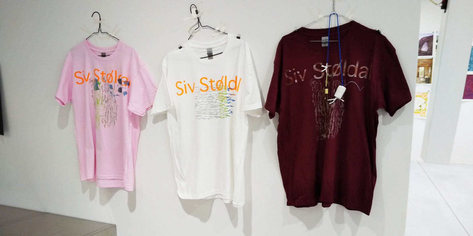 Siv will provide T-shirts in a variety of colors. Samples with original ink are displayed for participants.